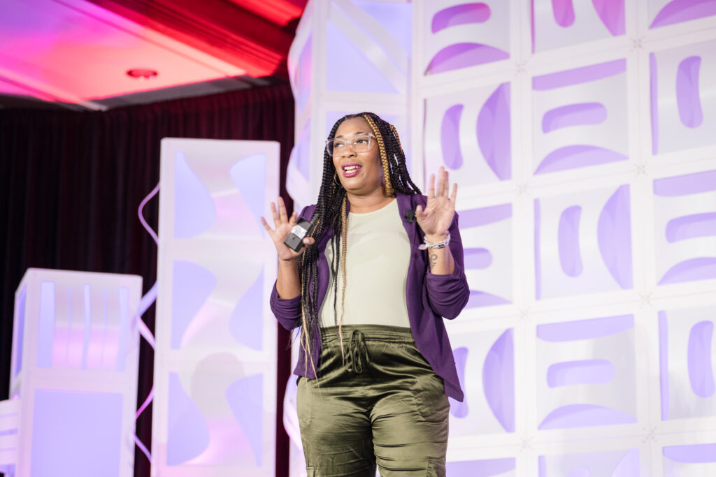 Cass Cooper speaking on stage, Imperial Council Member